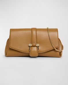 "Find SALVATORE FERRAGAMO F-show Small Flap Shoulder Bag on Editorialist. Ferragamo \"FShow\" shoulder bag in leather Chain shoulder strap Adjustable crossbody strap Can be worn as a shoulder or crossbody bag Flap top with magnetic closure; Gancini hardware Divided interior; one zip pocket Approx. 5.5\"H x 10.2\"W x 3.9\"D Made in Italy" Elegant Calf Leather Bag With Fold Over Clasp, Evening Bags With Fold Over Clasp In Calf Leather, Leather Shoulder Bag With Fold Over Clasp, Elegant Calf Leather Pouch Shoulder Bag, Designer Leather Clutch With Gold-tone Hardware, Flap Shoulder Bag, Leather Chain, Crossbody Strap, Magnetic Closure