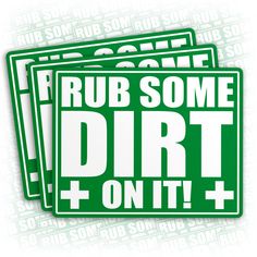 two green stickers that say rub some dirt on it