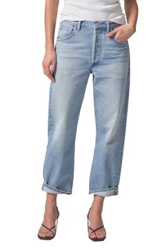 Meant to be worn low on the waist, these slouchy, vintage-inspired nonstretch jeans flaunt bow legs that taper to the ankles and end in uneven cuffs. 24" cuffed inseam; 25" inseam; 16" leg opening; 12" front rise; 15" back rise (size 29) Button fly Five-pocket style 100% regenerative cotton Machine wash, tumble dry Made in the USA of imported fabric Cotton Tapered Leg Jeans With Button Closure, Tapered Leg Denim Blue Jeans With Belt Loops, Tapered Leg Rigid Denim Pants With Belt Loops, Pull-on Denim Bottoms With Tapered Leg, Tapered Leg Jeans In Rigid Denim With Double-needle Stitching, Bow Legged, Citizens Of Humanity, Leg Jeans, Dahlia