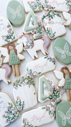 some decorated cookies are laying on a table