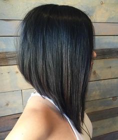 the back of a woman's head with black hair and long straight bobs