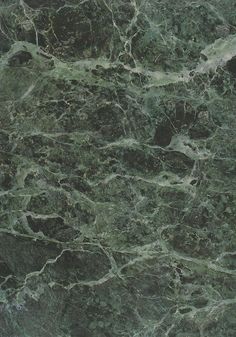 a green marble textured surface with black and white lines on the top, as well as dark grey veining