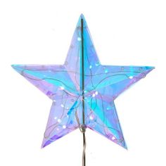 a blue lighted star on top of a metal pole