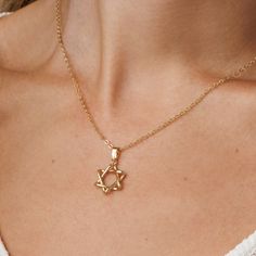 Adorn in style with this 14k gold-filled Star of David necklace. Fashionable Jewish Magen David pendant for women. Shower-safe, tarnish-resistant, adjustable chain--perfect for everyday elegance and gifting. Choose between: A stunning gold hue, crafted from 14K gold-filled material. An elegant silver shade, made of stainless steel with a rhodium cover. Dainty Star Of David Jewelry For Anniversary, Elegant 14k Gold Filled Necklace With Star Charm, Elegant 14k Gold Filled Star Jewelry, Classic Star Of David Necklace As Gift, Elegant Star-shaped 14k Gold Filled Jewelry, Classic Star Shaped Necklace For Gift, Elegant 14k Gold Star Of David Jewelry, Elegant Everyday Star Of David Necklace, Yellow Gold Star Of David Jewelry With Delicate Chain