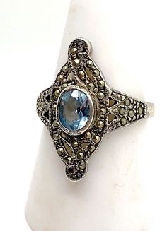 Edwardian Style Aquamarine and Marcasite 925 Silver Ring A Antique  Style Fancy ring All marcasites are intact The size is Q½  Do make sure you look at the ring on the ringsizer  to give you the best idea of fit In Fine Vintage Condition ((Apologies for the dull lighting in the video)) 🎀Thank you so much for looking🎀 Please don't miss my other items in this shop: https://www.etsy.com/uk/shop/PoshGemz *Please note I don't add boxes it makes postage expensive  (Unless it is a box that is bespoke Vintage Oval Marcasite Rings, Vintage Marcasite Oval Rings, Marcasite Gemstone Ring For Anniversary, Vintage Silver Multi-stone Sapphire Ring, Vintage Marcasite Ring Stamped 925, Silver Marcasite Ring With Gemstone, Edwardian Style, Fancy Rings, Edwardian Fashion