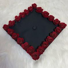 a graduation cap made out of paper roses