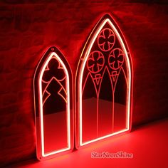 two red lighted windows sitting next to each other