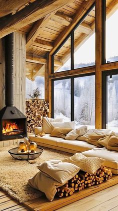 a living room filled with furniture and a fire place in front of a window covered in snow