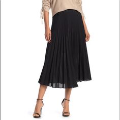 An On-Trend Midi Length Skirt Features A Chic Pleated Construction And Flowy Look. Excellent New Condition No Visible Flaws Or Signs Of Wear 34" Length (Size S) Elasticized Waist Pull-On Style Pleated Construction Partially Lined 100% Polyester With 65% Polyester, 35% Rayon Lining Dry Clean Imported Model Stats: 5'10" Height, 32" Bust, 25" Waist, 36" Hip. Model Is Wearing Size S. Item #6309659 Black Pleated Hem Skirted Bottoms, Spring Black Pleated Skirt Bottoms, Black Pleated Skirt With Pleated Hem For Spring, Black Skirted Bottoms With Pleated Hem, Pleated Tiered Skirt For Work, Black Tiered Skirt For Workwear, Black Tiered Skirt For Work, Black Pleated Hem Skirt For Summer, Summer Black Pleated Hem Skirt