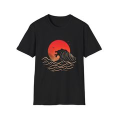 a black t - shirt with an image of a wave in the sunset