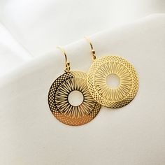 "Discover the exquisite beauty of our Big GOLD CIRCLE earrings by Anemon. These Boho Mandala Earrings boast delicate filigree and dangle circles, making them the perfect art deco jewelry gift for women. Made with 24k gold plated over sterling silver 925, they sparkle with every movement. Lightweight and comfortable, these earrings are ideal for every woman. Experience their stunning beauty and exceptional quality today! ♡ DETAILS  Earrings total lenght: 1.57 \" (4 cm) Material:24k gold plated 92 Gold 14k Gold-filled Round Earrings, 14k Gold-filled Round Earrings, Nickel Free Gold Plated Circle Earrings, Gold Circle Earrings 14k Gold Filled, Nickel-free Gold Plated Circular Earrings, Yellow Gold Circle Brass Earrings, Nickel-free Gold-plated Circular Earrings, Yellow Gold Circle Earrings In Brass, Elegant Metal Round Disc Earrings