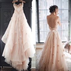 the back of a wedding dress is shown in three different pictures, one with an open back