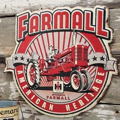 the farmall logo is shown in red and white, with an image of a farmer on