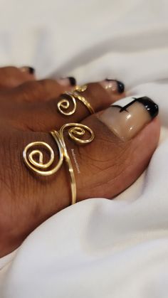 "Unique yet stylish toe rings that are delicately handmade and sure to bring a hint of beauty to whatever you pair them with. You have the option of a single toe ring or you can choose to purchase the bundle which is one big toe ring and one regular size toe ring for a discounted price. Choosing the bundle is the best deal for your buck. *All rings are made adjustable, you can size up or down by twisting inward or outward *Big toe rings are made at a size 12, regular toe rings are made at a size Gold Toe Rings, Rings Wire, Dope Jewelry Accessories, Dope Jewelry, Ring Simple, Toe Ring, Jewelry Lookbook, Wrapped Jewelry, Handmade Wire