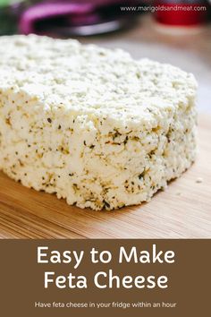 a piece of feta cheese sitting on top of a wooden cutting board with text overlay that reads easy to make feta cheese