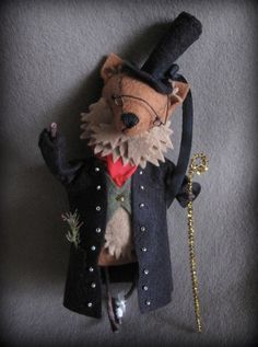 a stuffed animal with a top hat and coat