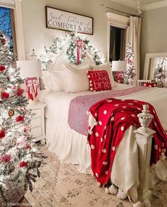 a bedroom decorated for christmas with red and white decor