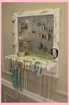 a jewelry rack is hanging on the wall