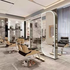 the interior of a salon with chairs and mirrors