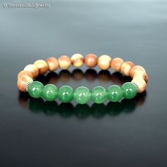 "❖ GREEN JADE: Natural 8mm gemstone ❖ ♥ Stability ♥ Longevity ♥ Fertility ♥ Serenity ♥ Wisdom ♥ Practicality ♥ Tranquility ♥ Balance ♥ Peace ♥ Harmony ♥ Moderation ♥ Perspective ❖ CEDAR WOOD: Natural 8mm wooden beads ❖ ♥ Strength ♥ Purification ♥ Spiritual protection ♥ Healing ❖ SPACERS: Antique pewter charms made in USA. ❖ Durable Elastic Stretch Cord. ❖ The gemstones are natural, so you may see some variations. ❖ Your purchase will arrive attractively packaged and ready to give. ❖ Size ❖ Women Green Jade Stretch Bracelet For Meditation, Holistic Jade Beaded Bracelets With Round Beads, Green 8mm Beads Stretch Bracelet For Meditation, Holistic Jade Beaded Bracelets, Green Round Beads Bracelets For Meditation, Green Round Beaded Bracelets For Meditation, Green Round Beads Beaded Bracelets For Meditation, Green Aventurine Stretch Bracelet With Natural Stones, Green Gemstone Beaded Bracelets For Meditation