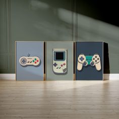 three nintendo wii game controllers are on display in front of a green wall and wooden floor