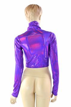 "This item is made to order, please read all the way through the listing before purchasing! Super shiny, sparkling holographic grape purple spandex. This crop top has a high turtle neckline and long sleeves, and a four way stretch fit. LENGTH: 8\" (from the underarm to the hemline) Womens Sizing (See below for instructions on where measurements should be taken) XXS: Bust 29\"-30\" / Waist 22\"-23\" / Hips 30\"-32\" Extra Small: Bust 31\"-32\" / Waist 24\"-25\" / Hips 33\"-35\" Small: Bust 33\"-3 Metallic Shiny Fitted Crop Top, Fitted Metallic Shiny Crop Top, Fitted Iridescent Tops, Purple Long Sleeve Stretch Crop Top, Metallic Long Sleeve Club Tops, Purple Stretch Long Sleeve Crop Top, Metallic Long Sleeve Tops For Club, Fitted Turtleneck Top For Party, Metallic Long Sleeve Disco Top