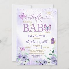 a baby shower with purple flowers and butterflies