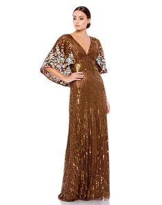 Mac Duggal  Sequined mesh overlay; 100% polyester lining Fully lined through body; sheer unlined sleeves V-neckline Cape sleeves Intricate rows of hand-stitched sequins and beading Floral detailing featured along cape Concealed back zipper Approx. 62.5" from top of shoulder to bottom hem Available in Chocolate (brown) Mesh Gown, Short Dress Styles, Estilo Real, Sequin Prom Dress, Mother Of The Bride Outfit, Column Gown, Cape Sleeves, Mac Duggal, Bride Clothes