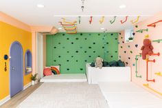 a room with colorful walls and climbing equipment