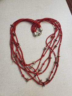 Chicos, Cardinal Red, 40 inch, 6 Strand Plastic Bead and Brass Bead, Layered Necklace, Costume Jewelry, Fashion Accessory This is a great find and a very large fashion statement. Very decorative and collectible. The measurement is taken from the top of the necklace to bottom strand. Check out our shop for monthly specials. We have a variety of items for every taste. Combine several of our items together to save on shipping. If you have any questions, please do not hesitate to ask. I will ship ou Red Beaded Long Necklace With Large Beads, Red Multi-strand Beaded Necklaces With Large Beads, Red Multi-strand Beaded Necklace With Large Beads, Red Multi-strand Beaded Necklace, Red Large Multi-strand Beads, Red Beaded Long Necklace For Gift, Red Beaded Long Necklace As Gift, Red Multi-strand Polished Beads Necklace, Red Faceted Beads Jewelry For Beach