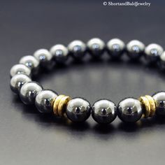 "❖ HEMATITE: Natural approx. 8mm gemstone ❖ ♥ Protection ♥ Absorb negative energy ♥ Stability ♥ Concentration ♥ Motivation ♥ Courage ♥ Stamina ♥ Vitality ♥ Confidence ♥ Optimism ♥ Balance ❖ SPACERS: Antique pewter charms in gold made in USA. ❖ Durable Elastic Stretch Cord. ❖ All our gemstones are natural so you may see some variations in bead size and color. If you purchase a bracelet with multiple bead types, the number of beads and their arrangement will vary depending on the size bracelet you Black Beaded Hematite Bracelets, Mens Black Bead Bracelet, Hematite Natural Stone Bracelet, Luxury Gemstone Beads Bracelet For Men, Mens Hematite Bracelet, Bead Types, Bracelet Materials, Hematite Bracelet, Stone Healing