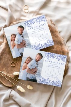 three wedding photos on top of a wooden slice with flowers and gold rings next to them