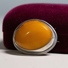 Vintage Sterling Silver Cabochon 28mm Egg Yolk Amber Pin Brooch - C Clasp 10.1g The early silver pin tested as sterling silver. Nice chunky Egg Yolk amber free form stone. There is a hallmark on the pin section Brooche's size is 1 1/4" by 1 1/8" Garnet Drop Earrings, Yellow Gold Cocktail Ring, Gold Cocktail Ring, Gold Cocktail, Tigers Eye Gemstone, Natural Amber, Silver Pin, Garnet Earrings, Pink Gemstones