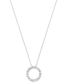 A gorgeous round diamond pendant set in white gold, crafted from a series of brilliant round stones. Timeless Silver Round Diamond Necklace, Dazzling Diamond Necklace With Brilliant Cut Round Pendant, Dazzling Round Diamond Necklace With Prong Setting, Dazzling White Gold Diamond Necklace With Round Cut, Round Cut Diamond Necklace With Pave Setting, Dazzling White Round Diamond Necklace, White Gold Diamond Necklace With Brilliant Cut Round Pendant, Diamond White Round Necklace With Pave Setting, White Diamond Platinum Pendant Necklace