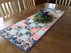 a table runner with a potted plant on it