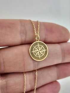 14K Solid Gold Compass Necklace, Personalized Compass Charm, Traveler Gift Pendant, Gold Disc Compass Jewelry, Navigation Compass Pendant 14 Material of pendant: Solid gold 14k ♣ Metal Stamp: 14k ♣The pendant is available in 3 sizes: 12.7 / 0,50 inches ( Diameter ) 15.2 mm / 0,60 inches ( Diameter ) 19,1 mm / 0,75 inches ( Diameter ) ( In the photos the size of the pendant is 15mm / 0.55 inches Diameter ) ♣ Material of chain: Solid gold 14k  Chain Length: ♥40 cm / 15,75 inches ( Length ) ♥45 cm / 17,72 inches ( Length ) ♥50 cm / 19,68 inches ( Length ) ♥ 55 cm / 21,65 inches ( Length ) Pendant thickness : 0.55mm Inner diameter of jump ring : 4mm Luxury Gold Necklace With Compass Design, Gold Brass Jewelry With Compass Design, Engraved Round Pendant Jewelry For Everyday Use, Everyday Engraved Round Pendant Jewelry, Travel Yellow Gold Jewelry With Compass Design, Luxury Compass Design Necklace As Gift, Classic Engraved Jewelry For Everyday, Personalized Gold Jewelry For Travel, Compass Design Medallion Jewelry As Gift