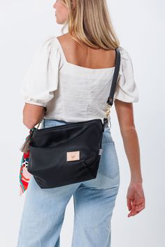 Your bag is proudly made in Lynchburg, Virginia using the finest materials in the world. 9.5"L x 14" Top Length x 11.5"H x 5.25"D 9" Shoulder Drop (measurement increases with the slouch of the bag) Crafted with exceptionally soft and rich Black Harness natural Italian leather* Includes a removable 19" leather shoulder strap and an adjustable leather crossbody strap that extends from 36" to 43" Straps are bench-made with black English Bridle leather** and solid brass hardware Exterior back phone Chic Travel Satchel In Pouch Shape, Chic Travel Satchel Pouch, Top Handle Hobo Bag With Removable Pouch For Travel, Luxury Hobo Bag With Removable Pouch For On-the-go, Travel Hobo Bag With Removable Pouch And Top Handle, Travel Hobo Bag With Removable Pouch, Versatile Pouch Satchel With Detachable Strap, Travel Hobo Bag With Detachable Strap Satchel, Travel Hobo Bag With Detachable Strap