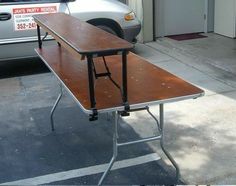 a table that is sitting in front of a car