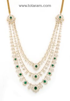 18 karat gold '3 lines -detachable / 7 in 1' diamond long necklace with color stones
  this item comes with 5 interchangeable color stones - red & green colored stones.
  * it can be used as a 3 layer necklace or
  * it can be used as a 2 layer necklace or
  * it can be used as a single layer necklace or
  * the one of the separate detachable pieces can be used as a maang tikka by itself
  note: it can also be used as a single line necklace separately without side pendants by using thr Luxury Multicolor Temple Necklace With Tilla Details, Luxury Elegant Temple Necklace With Zari Work, Luxury Long Temple Necklace For Celebration, Luxury Dual-tone Temple Jewelry Necklaces, Luxury Dual-tone Temple Necklace For Festivals, Luxury Dual-tone Temple Jewelry Necklace, Luxury Temple Necklace For Anniversary And Festivals, Luxury Multi-stone Temple Necklace For Festive Occasions, Luxury Dual-tone Temple Necklace