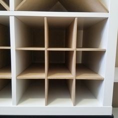 a white bookcase with many shelves on it