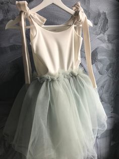 "A beautiful tutu dress great for any occasion! Birthday party, flower girl dress, ballet outfit or for dancing around at home!  Super soft jersey top fully lined with a soft tulle bottom. This dress has tie straps which makes it easy to adjust.  All dresses are made by hand by me only which makes each dress unique and one of a kind.  Please allow 1-2 weeks for production, dresses with intricate beading will take 3-4 weeks.  I am happy to make a custom order as well as add some sparkle or beadin Summer Ballet Tutu Dress For Dress-up, Summer Tulle Dresses With Bow Straps, Spring Princess Tutu Dress With Bow, Spring Princess Style Tutu Dress With Bow, Spring Balletcore Tutu Dress With Ruffles, Fitted Sleeveless Tutu Dress With Bow, Summer Tutu Dress With Bow For Dress-up, Spring Dress-up Tutu Dress With Tulle Skirt, Summer Tulle Tutu Dress For Dress-up