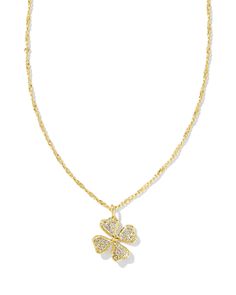 The good luck charm you didn’t know you needed—until now. The Clover Gold Crystal Short Pendant Necklace in White Crystal is an elevated take on a classic symbol of luck, featuring dainty crystal details for a super sparkly finish. Metal 14k Yellow Gold Over Brass Material White Crystal Closure Spring Ring Clasp Size 19" Chain, 0.61"L X 0.77"W PendantDue to the one-of-a-kind nature of the medium, exact colors and patterns may vary slightly from the image shown. | Kendra Scott Clover Gold Crystal Short Pendant Necklace in White Crystal | 14K Yellow Gold Symbol Of Luck, Short Pendant Necklace, Kendra Scott Necklace, Gold Shorts, Luck Charm, Clover Necklace, Luck Charms, Gold Crystal, Crystal Necklace Pendant