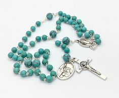 Gemstone Catholic 5 decade rosary made with 5mm turquoise beads,8mm gemstone beads on the place of Our father beads,miraculous medal centrepiece and st benedict crucifix. Give a gift of love and prayer with these wonderful rosaries. Hand made in Medjugorje. Feel free to contact me if you have any question. Thank you for stopping by! For more similar items and different colors visit our store: https://www.etsy.com/shop/Thelightjewelry?ref=seller-platform-mcnav Turquoise Rosary Bracelet With Round Beads, Turquoise Spiritual Rosary Bracelet With Round Beads, Spiritual Turquoise Rosary Bracelet With Round Beads, Turquoise Rosary With Round Beads, Spiritual Turquoise Rosary With Round Beads, Turquoise Rosary With Round Beads As Gift, Rosary Prayers Catholic, St Benedict Bracelet, St Benedict Cross