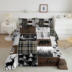 a bed covered in a black and white plaid comforter next to a night stand