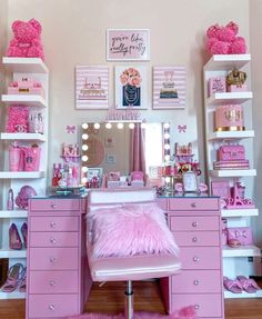 a room with pink furniture and decorations on the walls, including a vanity table covered in fluffy pink fur