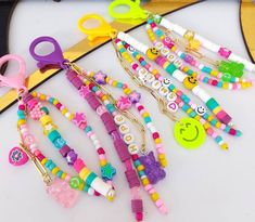 a table topped with lots of colorful bracelets and hair clips on top of each other