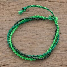 Inspired by the mountains of Atitlan Guatemalan artisan Mirian Zet creates this bracelet. In hues of green strands of nylon cord are braided by hand. This bracelet features a sliding knot for an adjustable length. Cheap Green Braided Bracelet For Women, Cheap Green Beaded Braided Bracelets, Fair Trade Green Jewelry For The Beach, Green Bohemian Bracelets With Adjustable Cord, Green Beaded Bracelets With Adjustable Cord For Beach, Green Beaded Bracelets With Adjustable Length, Green Adjustable Cord Friendship Bracelets For Beach, Green Beaded Bracelets With Adjustable Cord For Friendship, Green Beaded Bracelets With Adjustable Length For Friendship