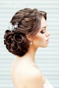 a woman wearing a wedding hair comb