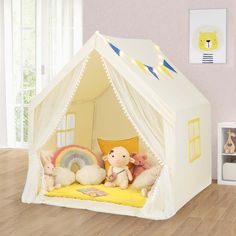 a child's play tent with stuffed animals in it