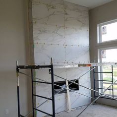 a room that has some scaffolding around it and a window in the background